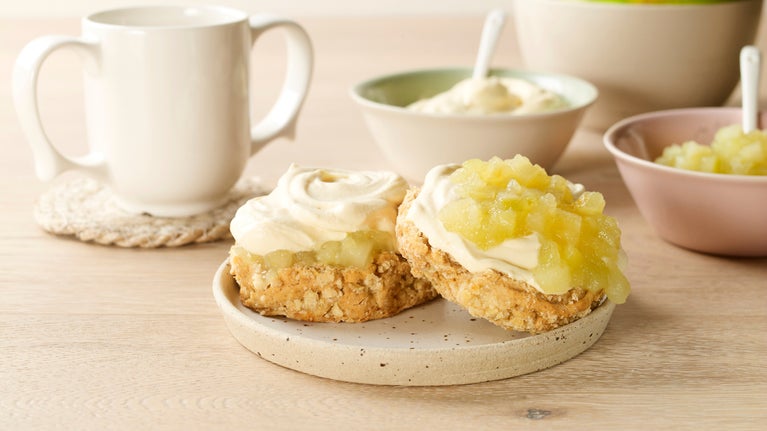 Apple and custard scone served with a cup of tea